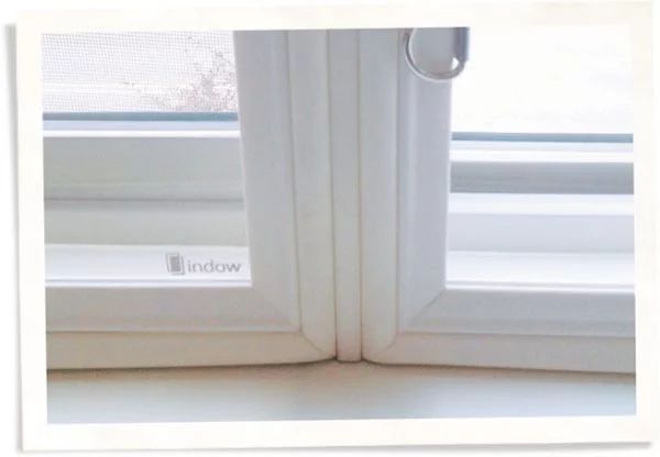 Indow window insert storm window mullion.