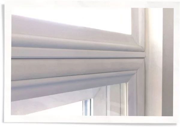 Indow window insert storm window mullion.