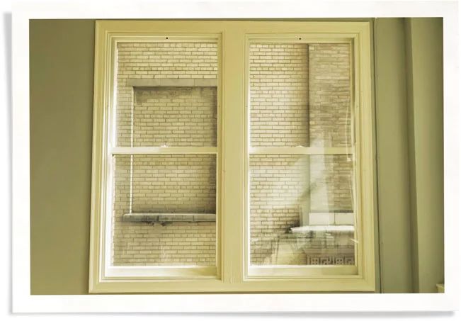 closeup of window inside condo with Indow - a window privacy covering