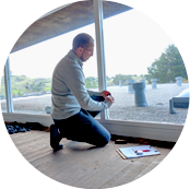 A person working on a window.