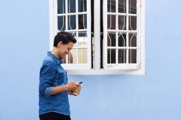 person walking by restored window